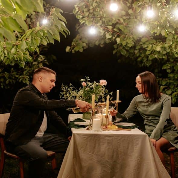 A couple on a candle-lit dinner