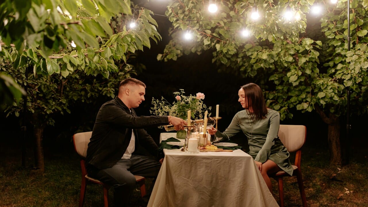 A couple on a candle-lit dinner