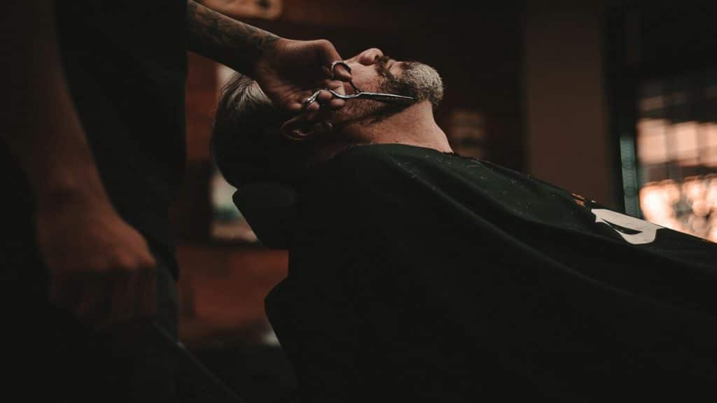 A man sitting on a barber’s chair