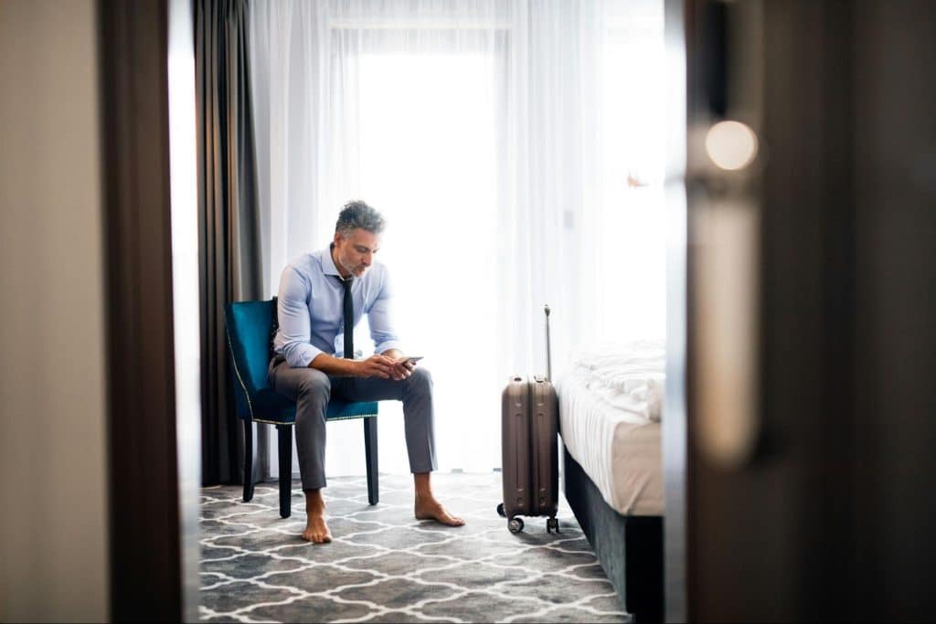 A man using a phone while sitting