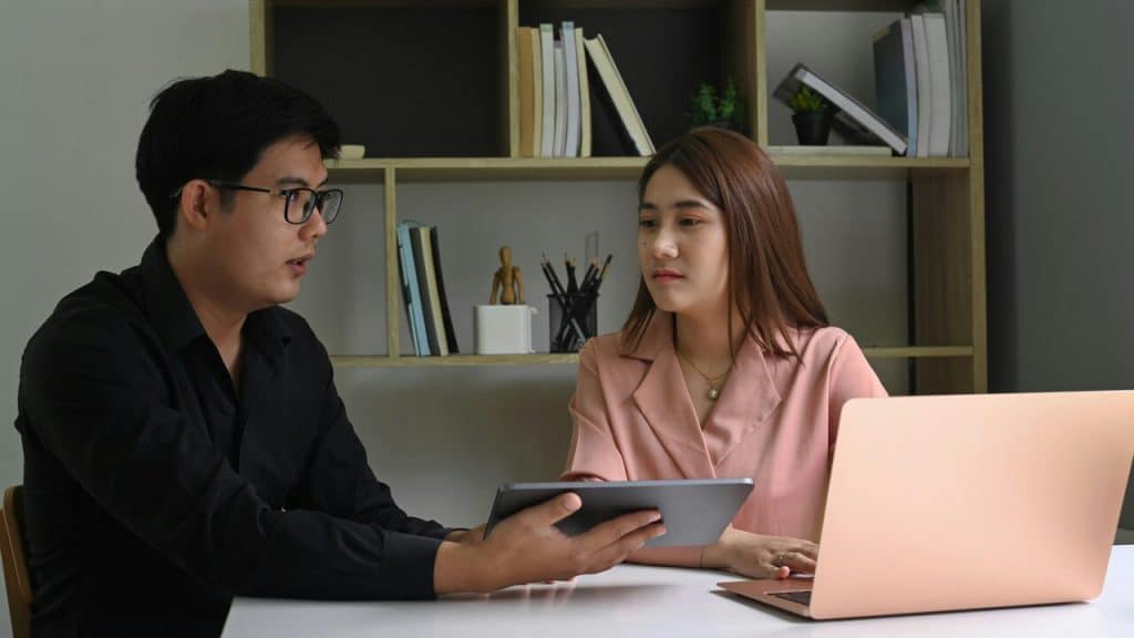 A couple looking at a tablet together 