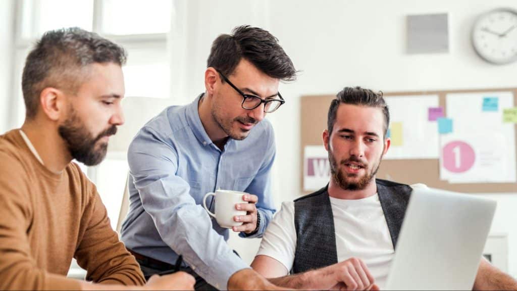 A man trying to speak with his colleagues