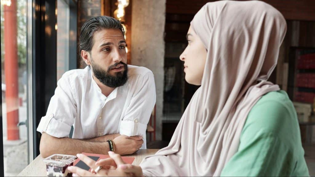 A man and woman looking at each other