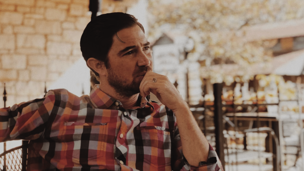 A man thinking at a restaurant 