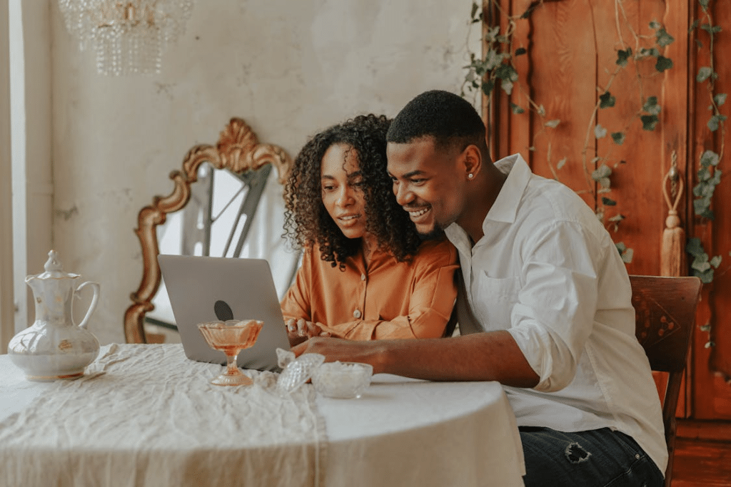 A couple using laptop together