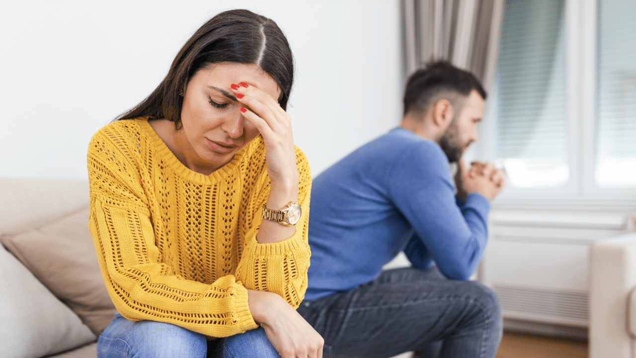A woman looking upset at her husband