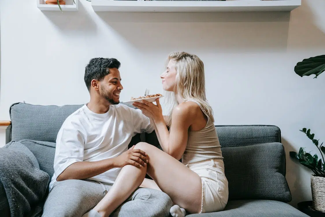 A couple sitting on a couch
