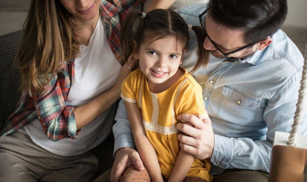 A man and woman with their child
