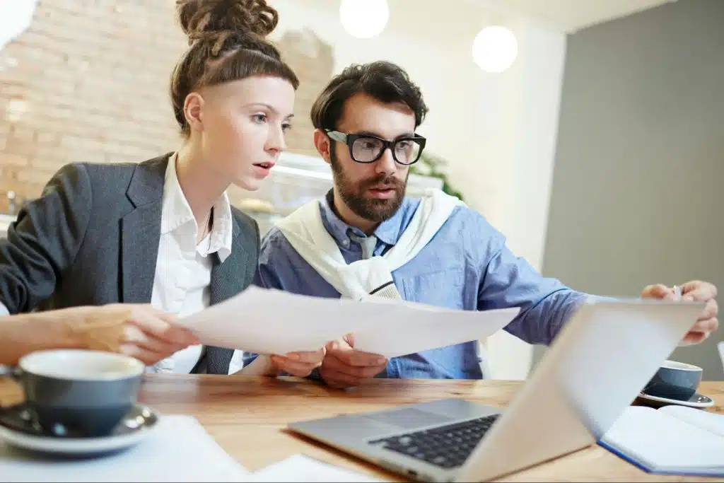 A man teaching a woman