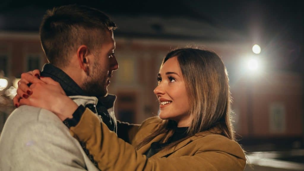 A man and a woman looking at each other.
