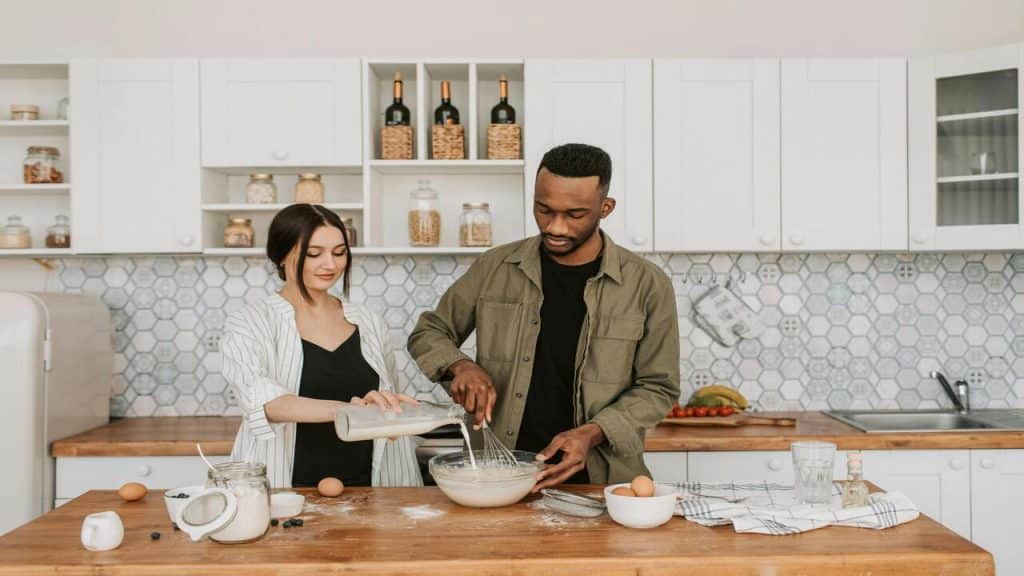 A couple cooking in the kitchen