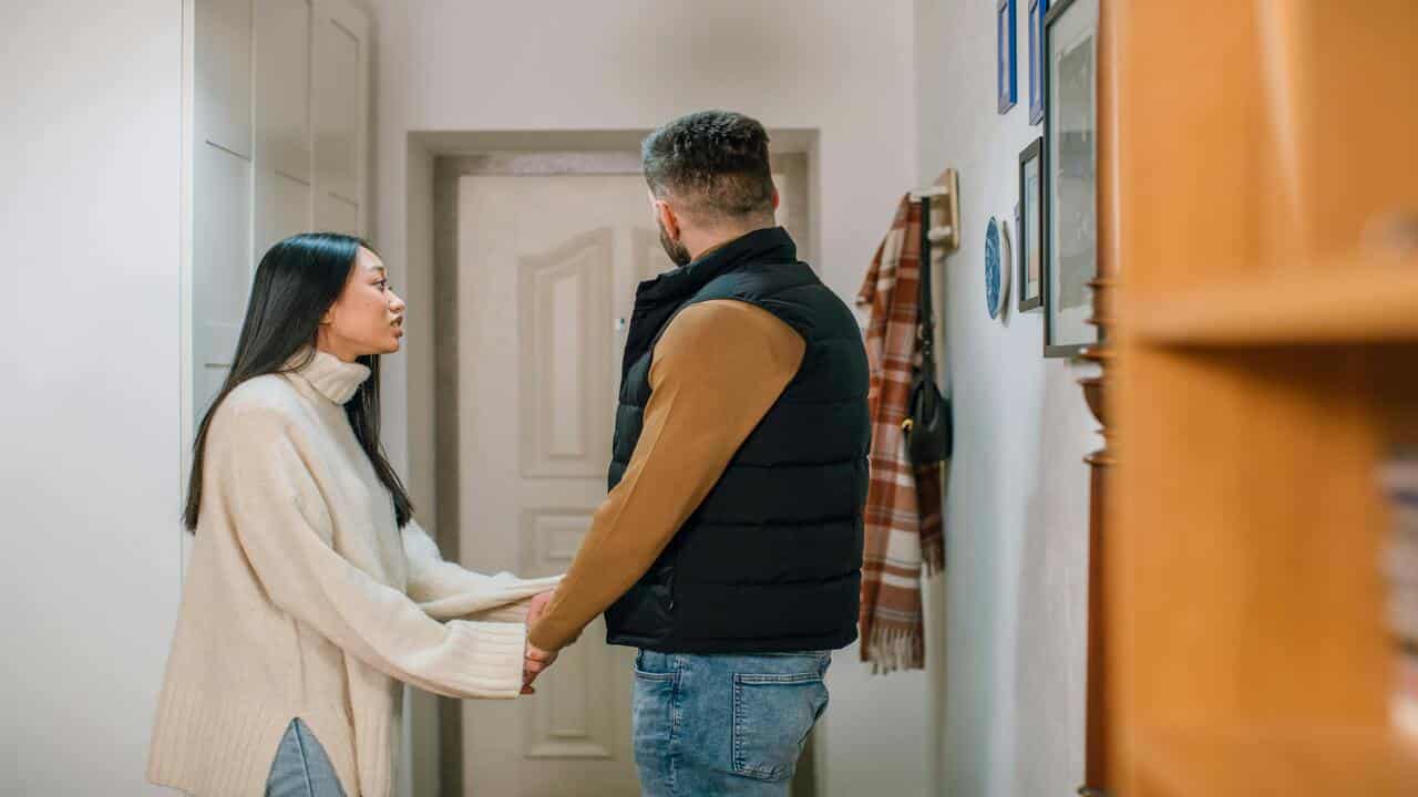 A woman trying to apologize to her husband