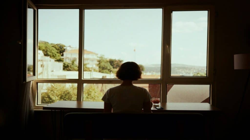 A woman looking out the window