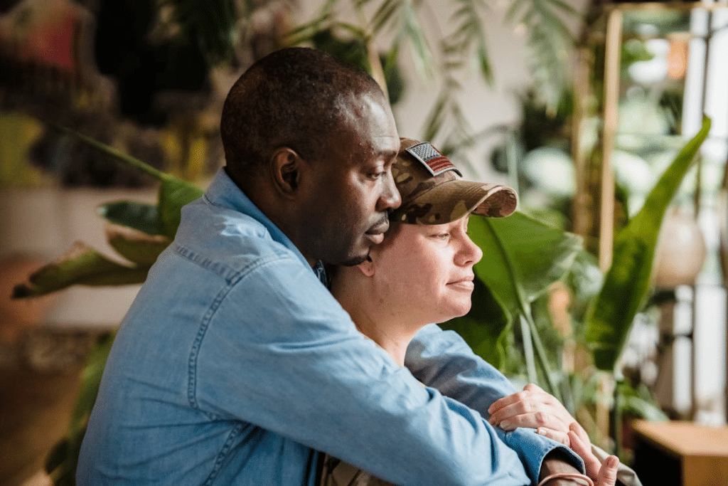 A man hugging a woman from behind