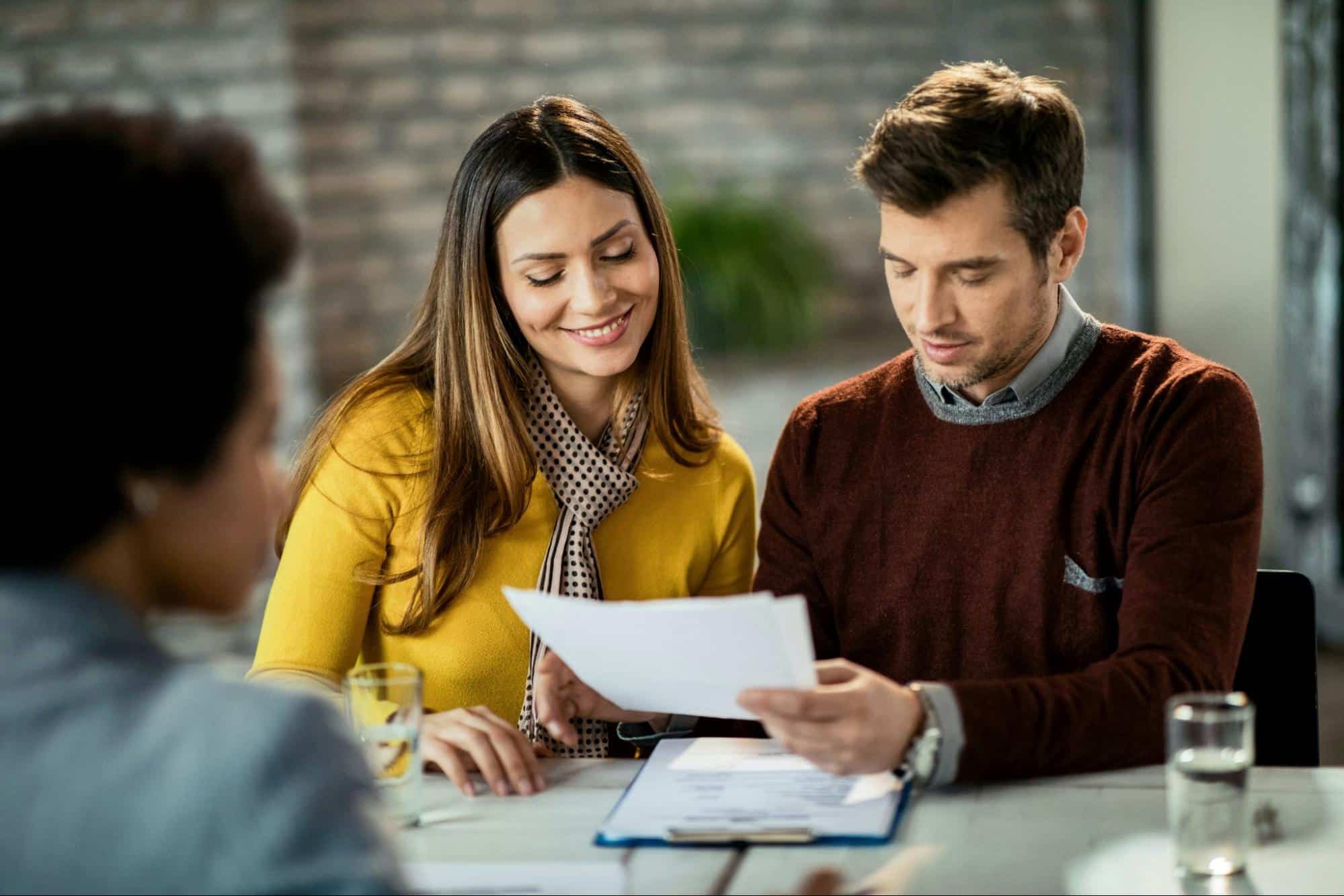A man and woman getting help from a professional