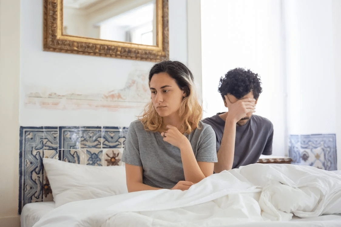 A couple arguing in the bedroom
