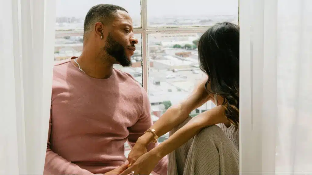 A man looking at the woman