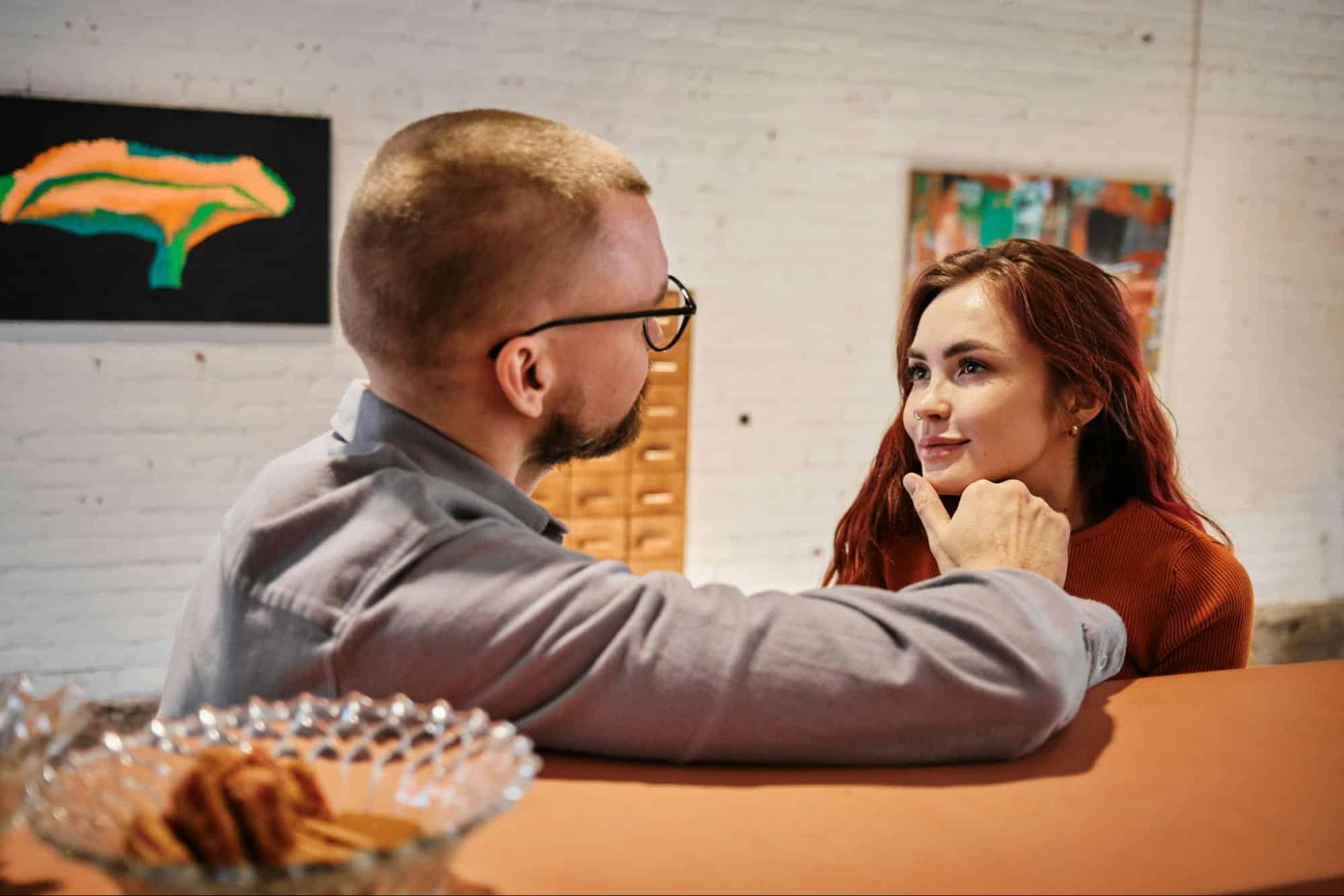 A man holding a woman’s chin