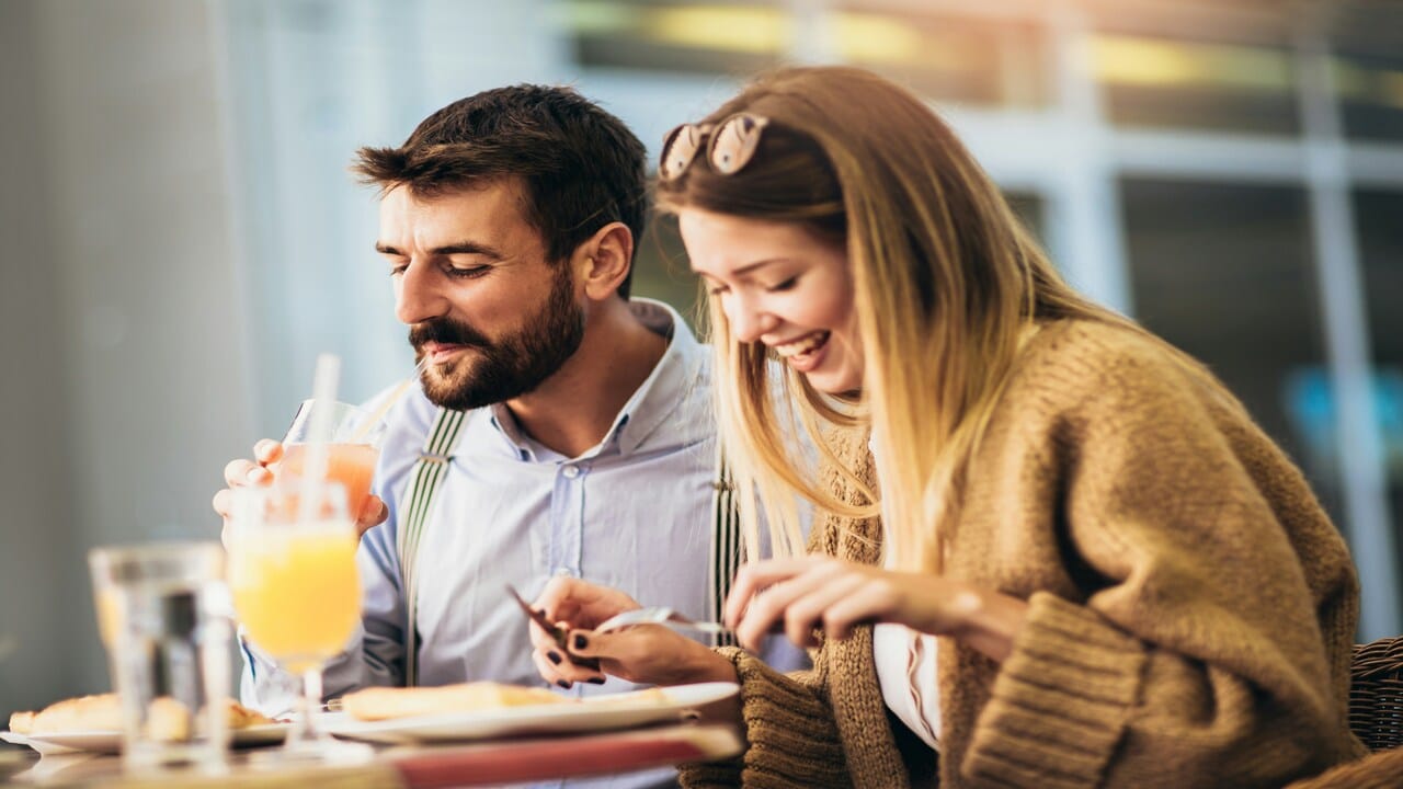 A couple having pizza together
