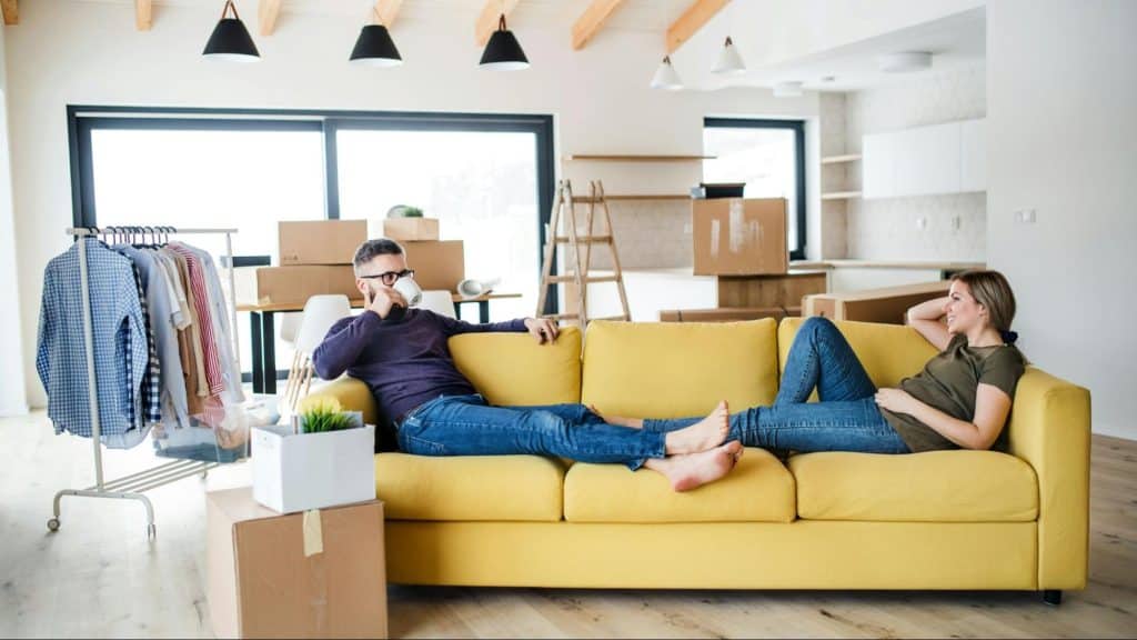 A man and woman at the couch