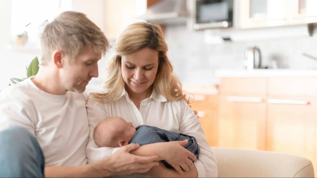 A man and woman with their child