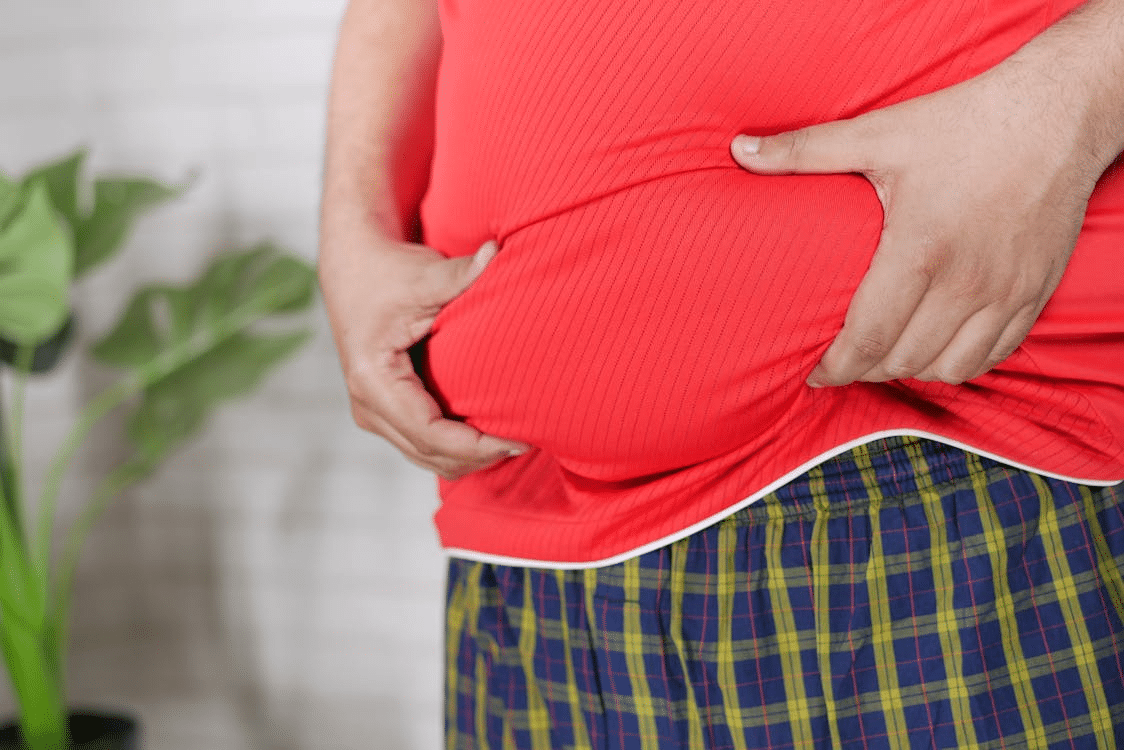 A man holding his belly
