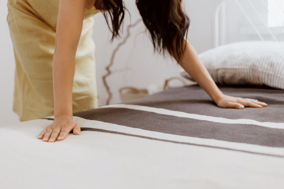 A woman making the bed