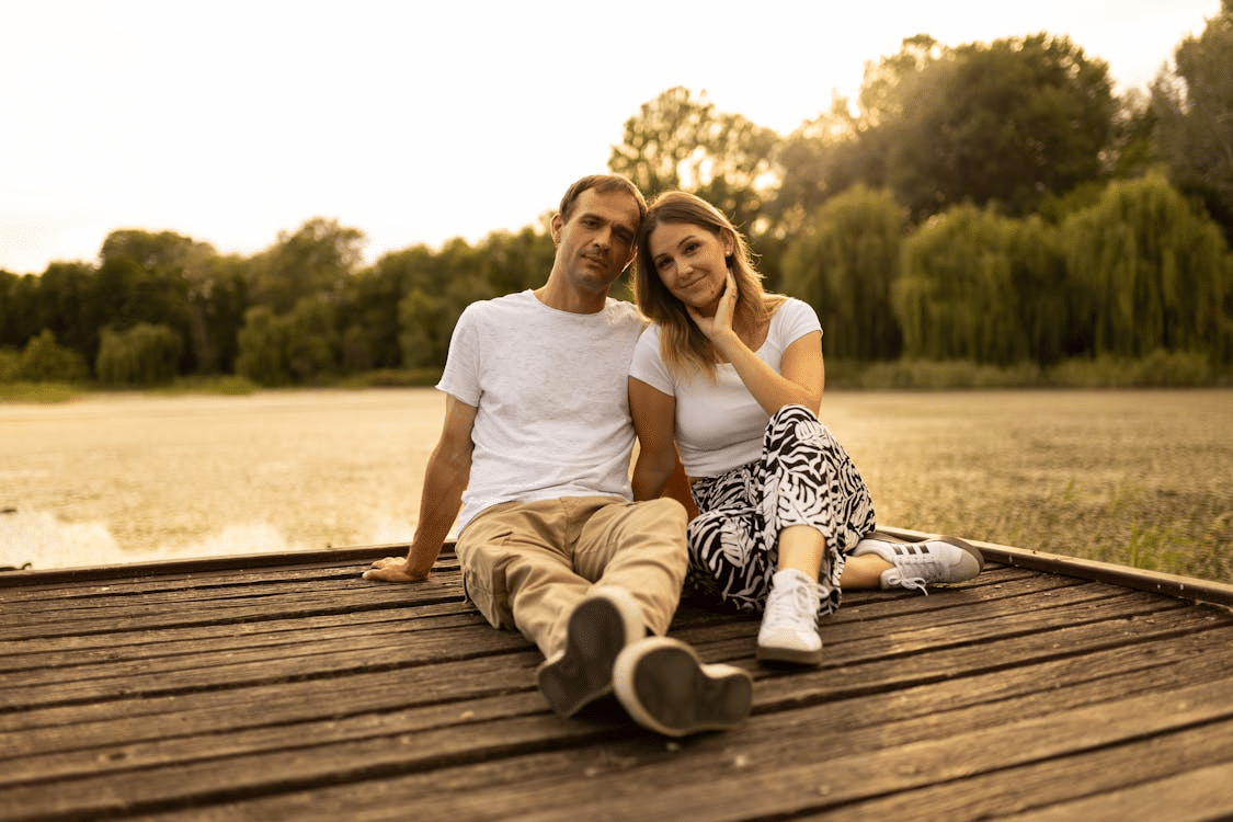 A couple sitting on a deck