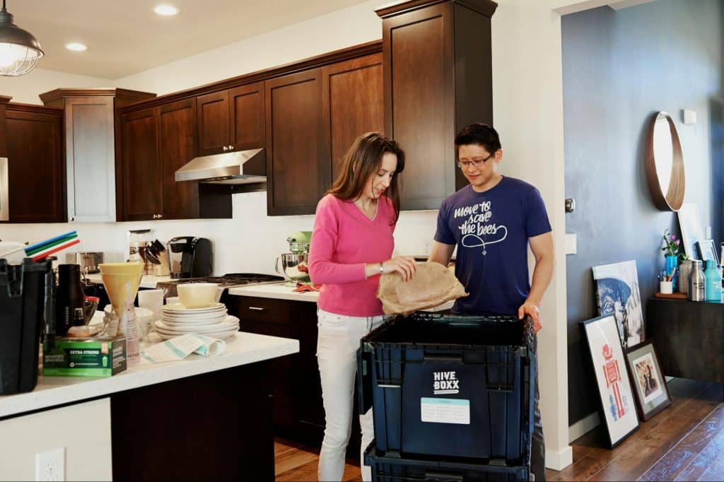 A man and woman organizing things at home