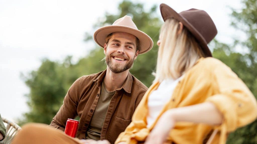 A couple talking with each other while spending time outdoors.