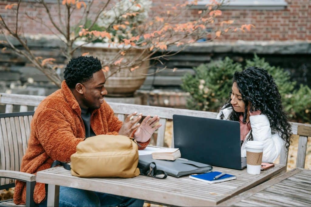 A man and woman sitting and talking