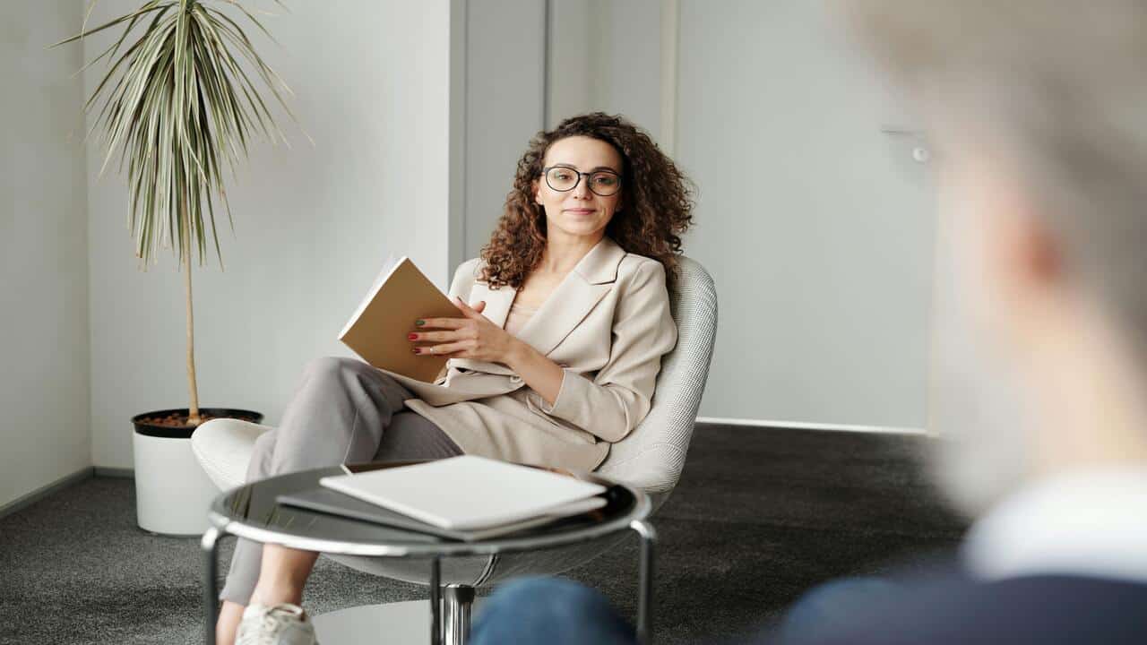 A woman looking at her colleague