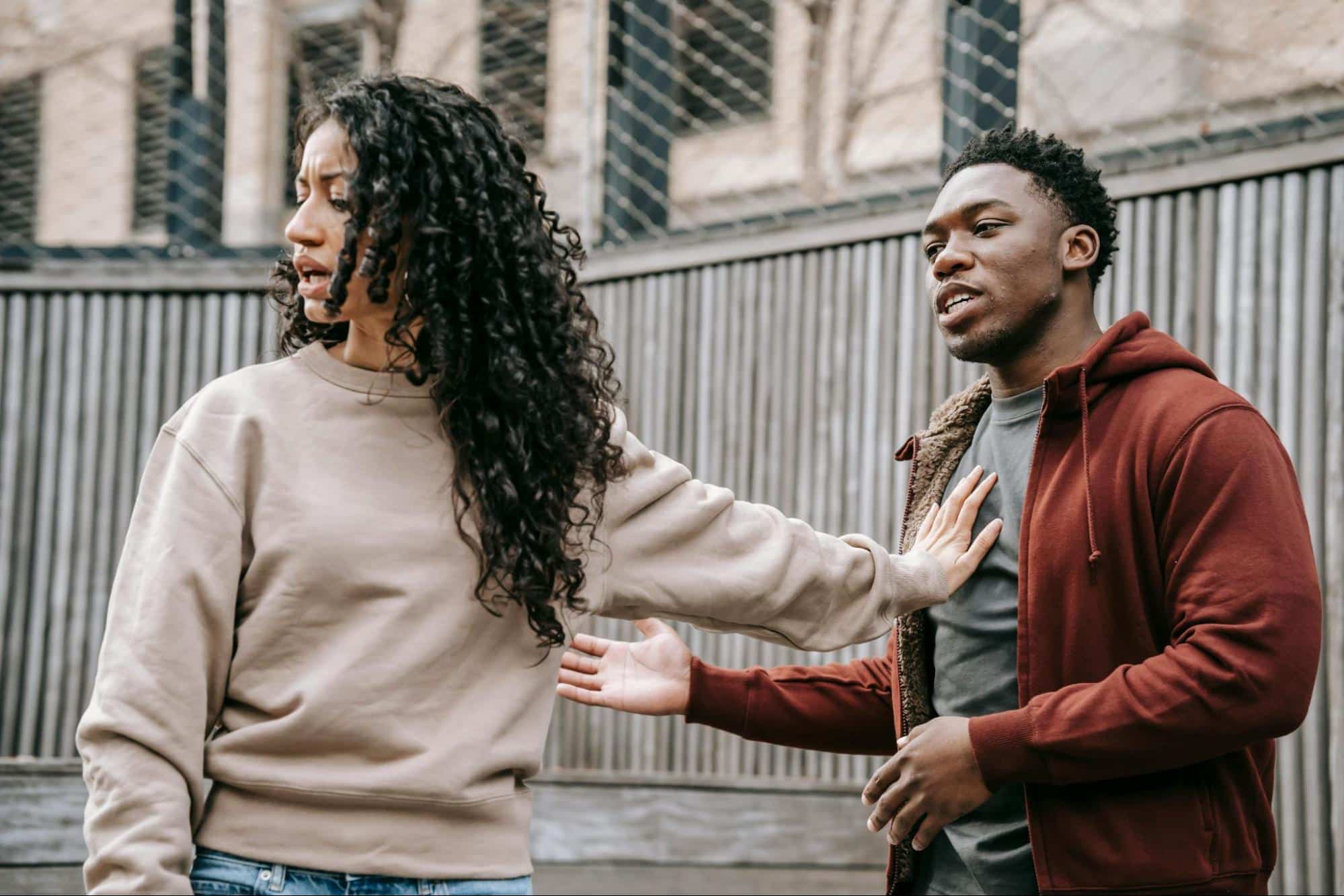 A man trying to speak with woman