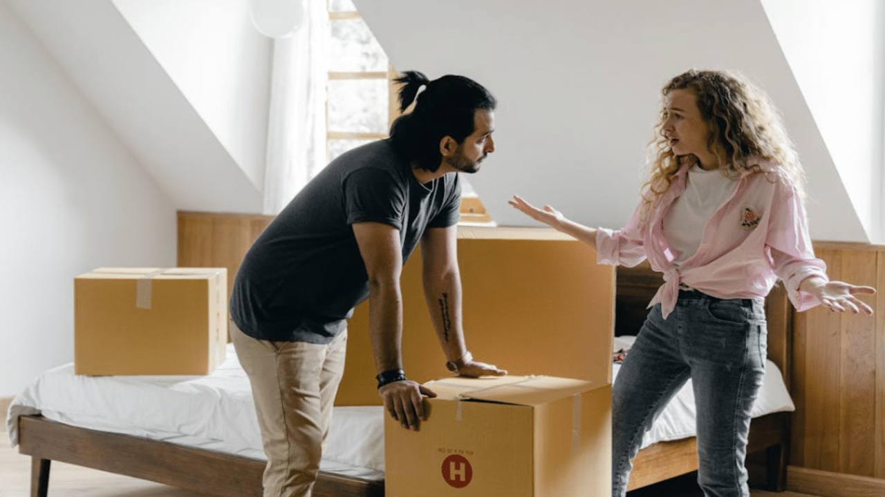 A couple arguing while moving