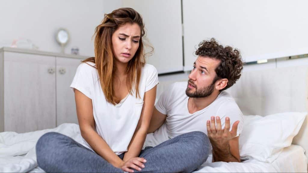 A man typing to talk to woman 