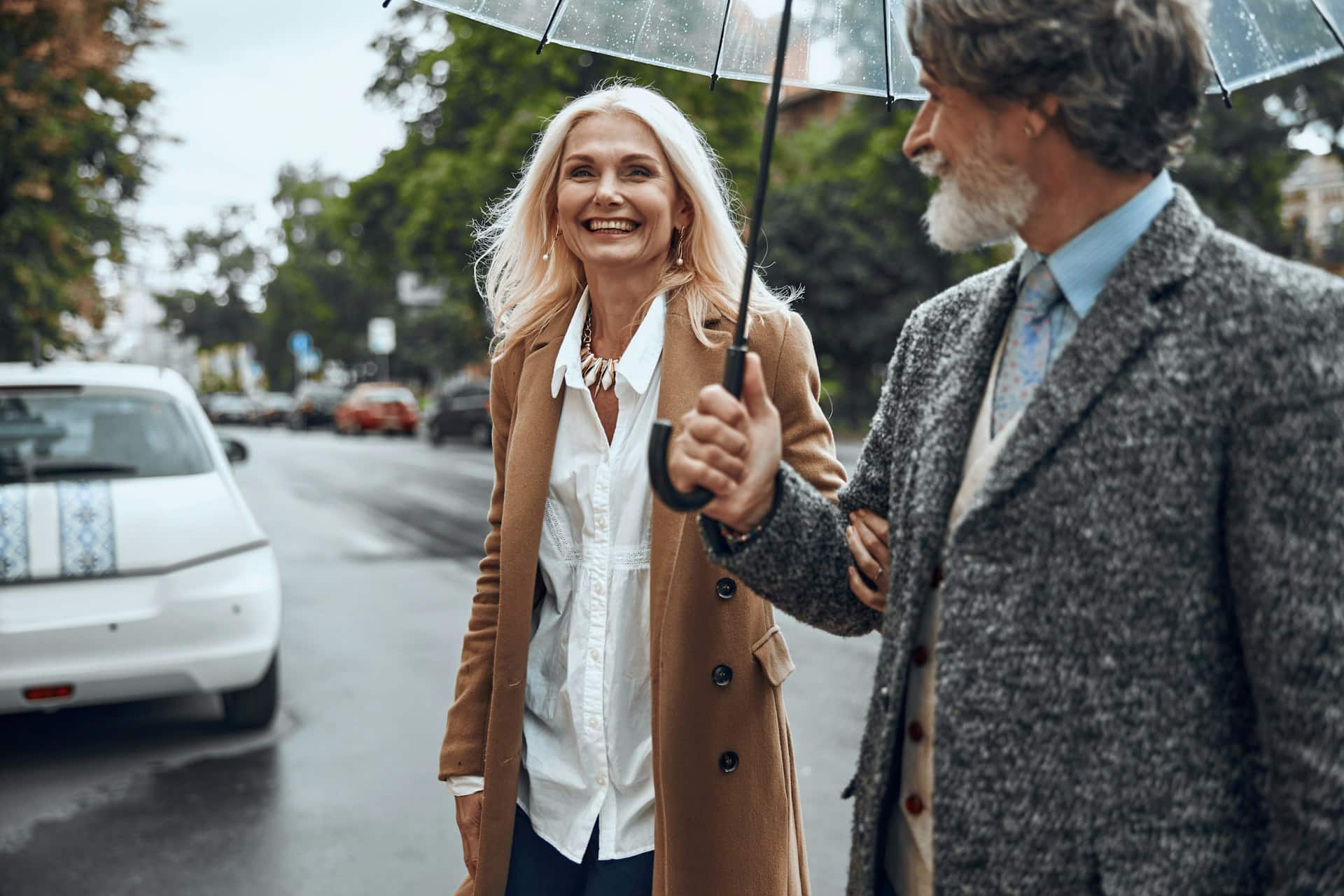 A mature couple crossing the street.