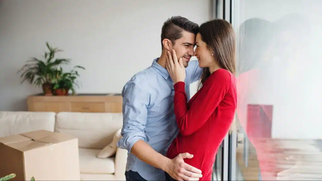 A man and woman smiling at each other