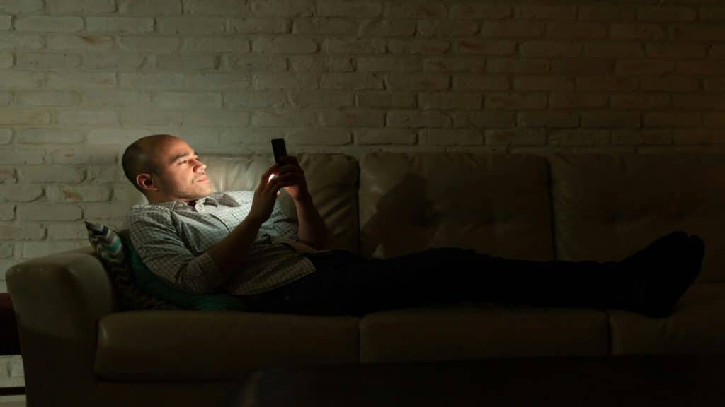 A man texting at night