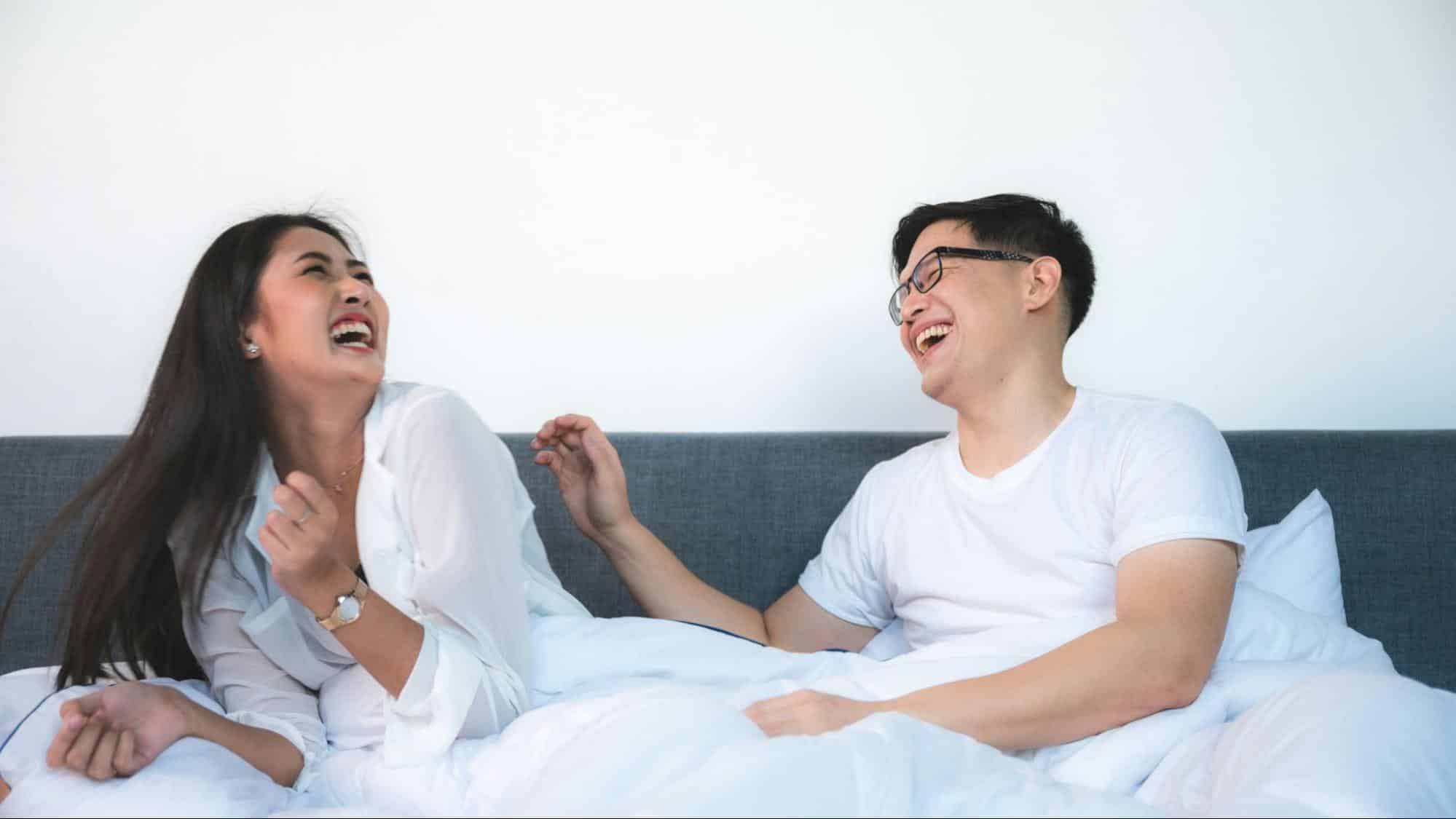 A man and woman laughing together