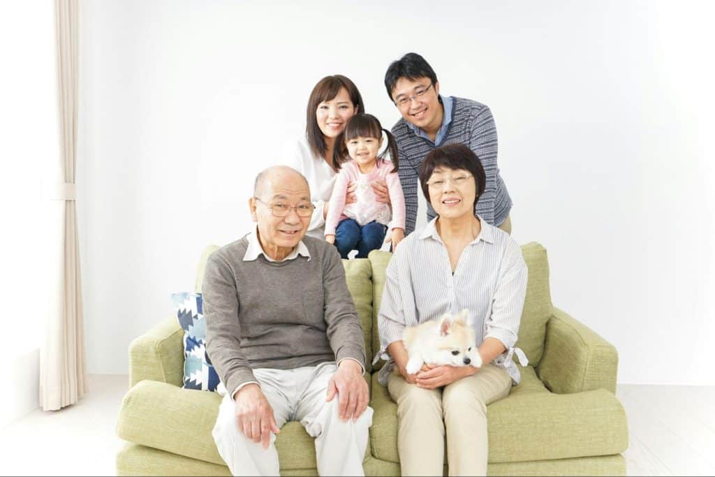 A couple having a family picture with their in-laws
