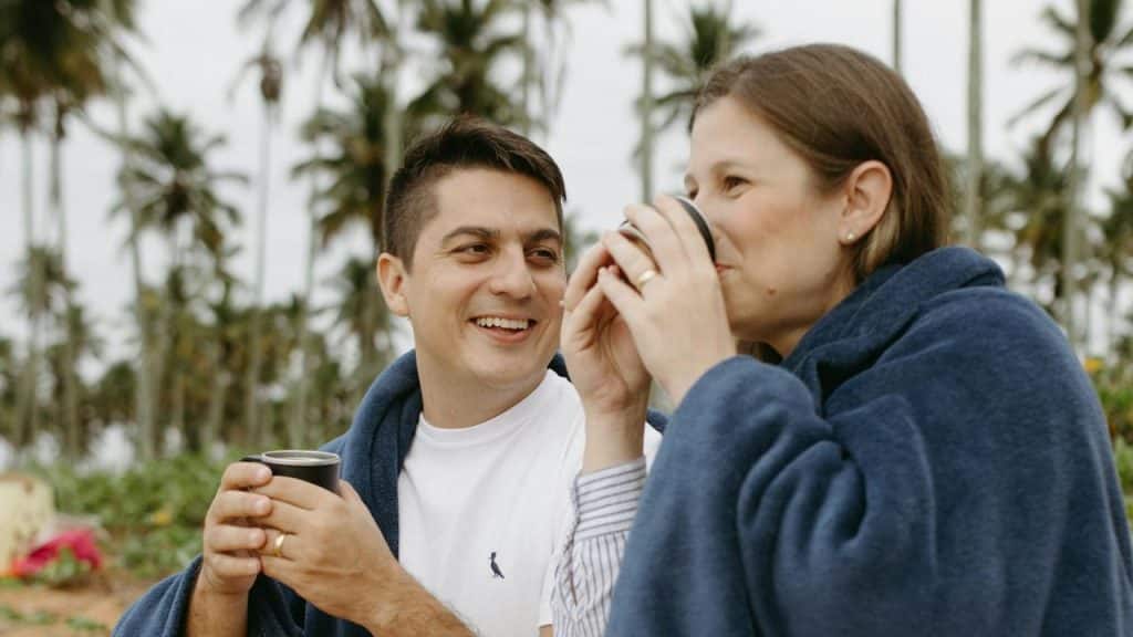 A couple having coffee and talking.