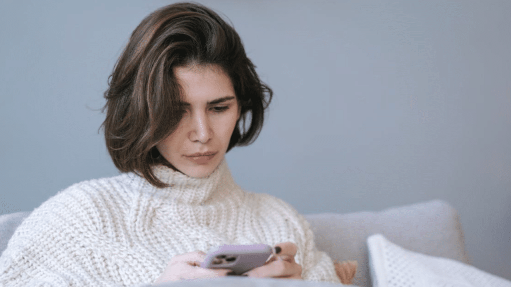 A woman waiting for a text 