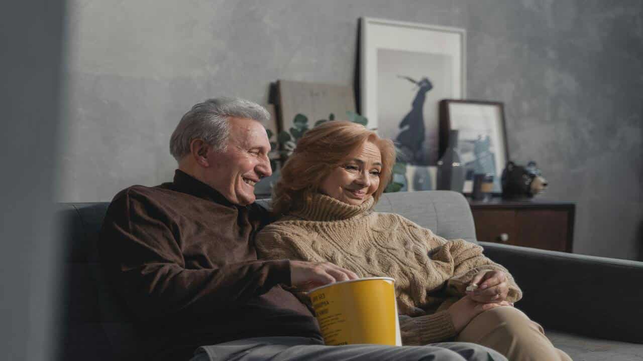 A couple relaxing on the couch