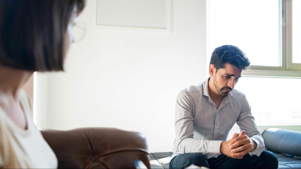 Woman talking to a man