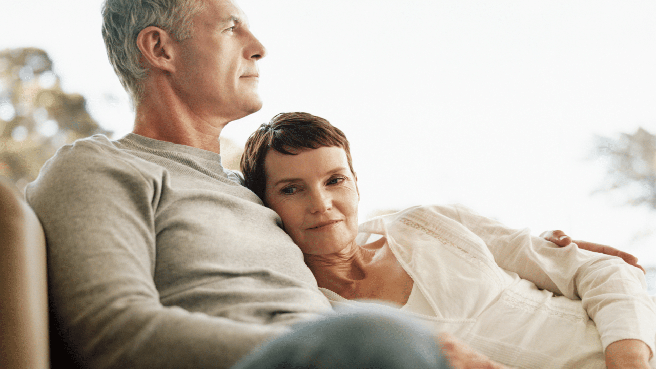 A couple sitting on the couch
