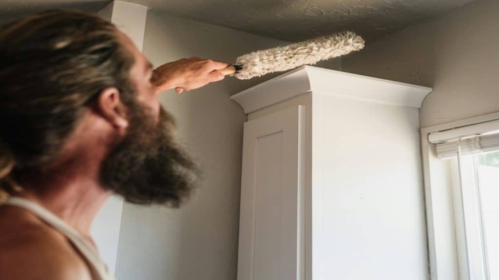 A man cleaning his home