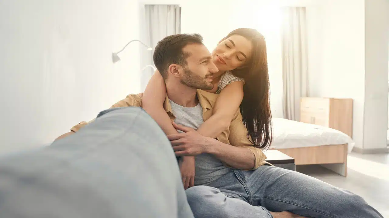 A couple being affectionate at home