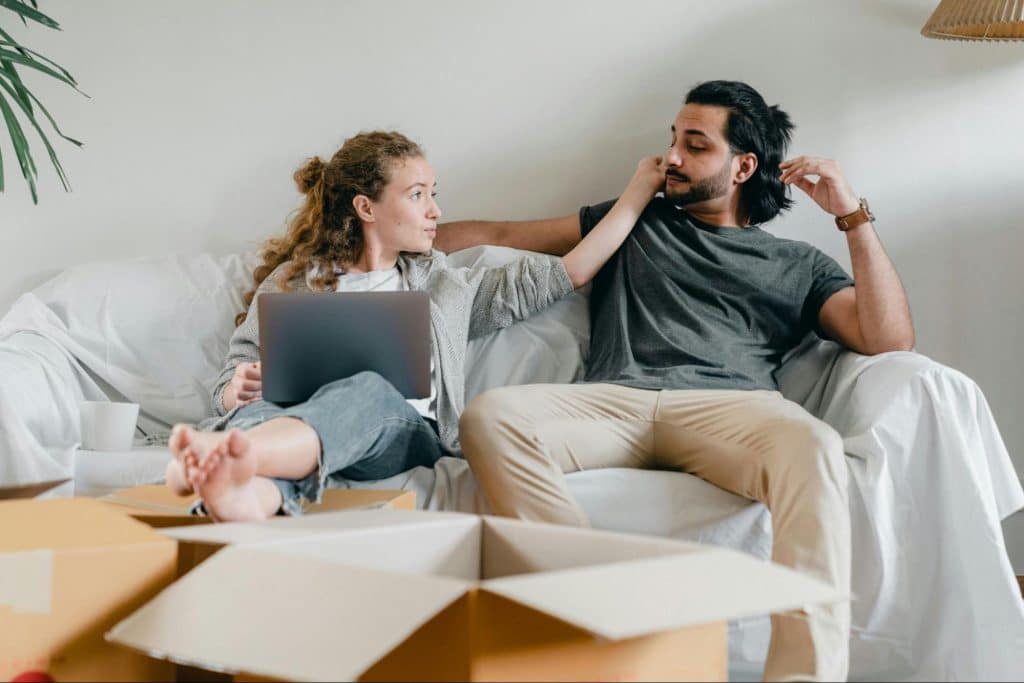 A man reaching for man’s face