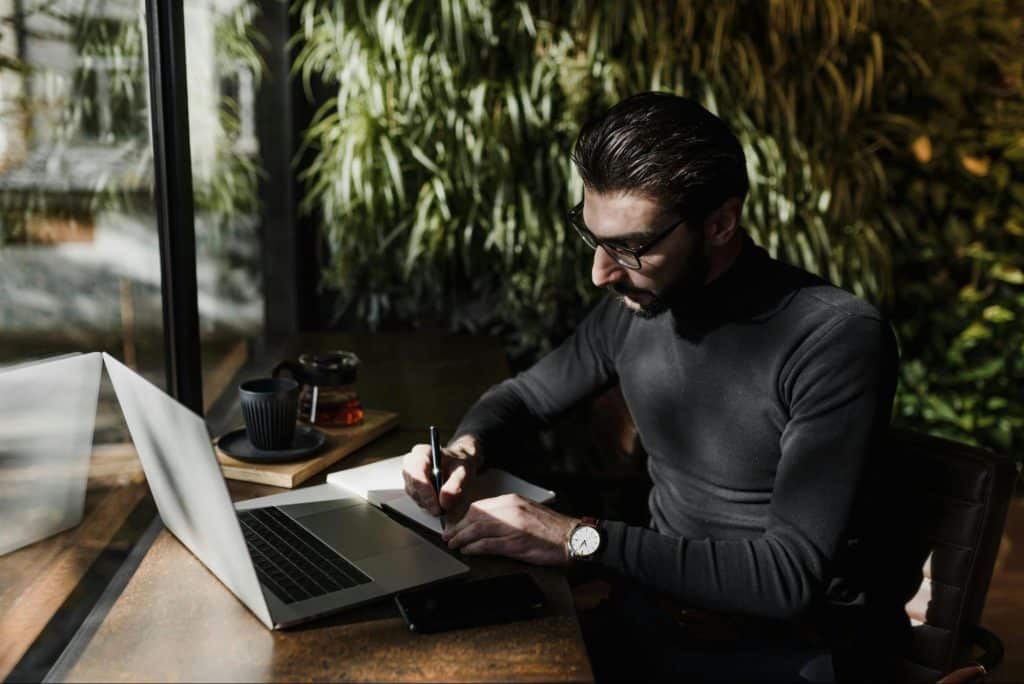 A man looking at the laptop
