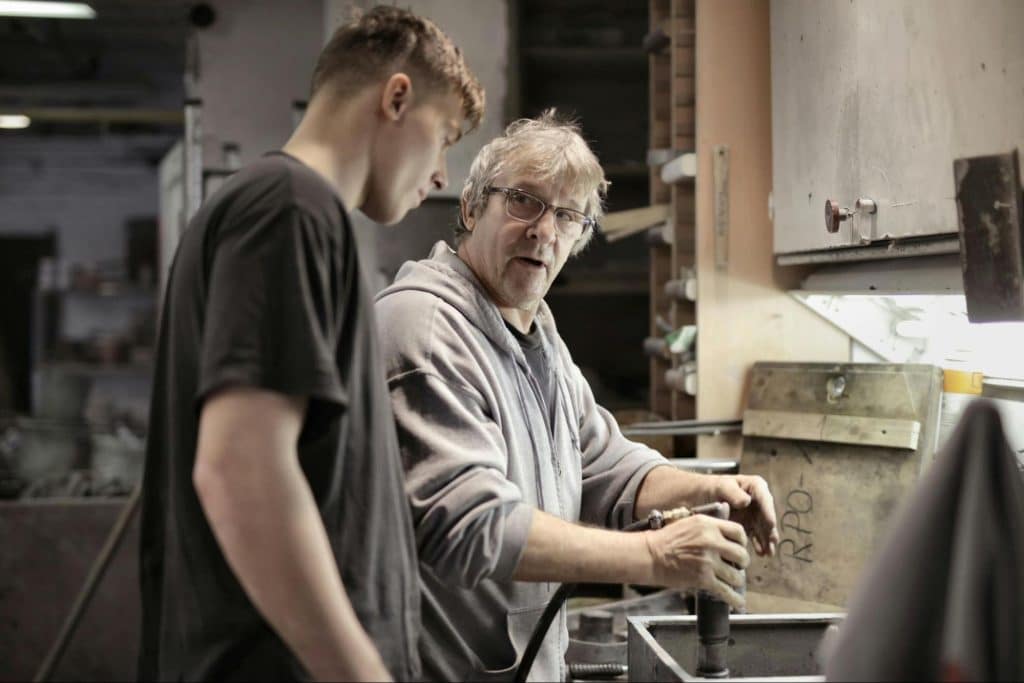 A man teaching another man